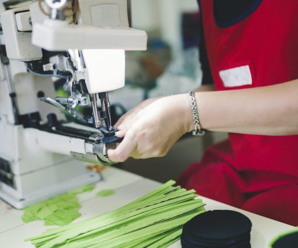 Worker in textile industry sewing